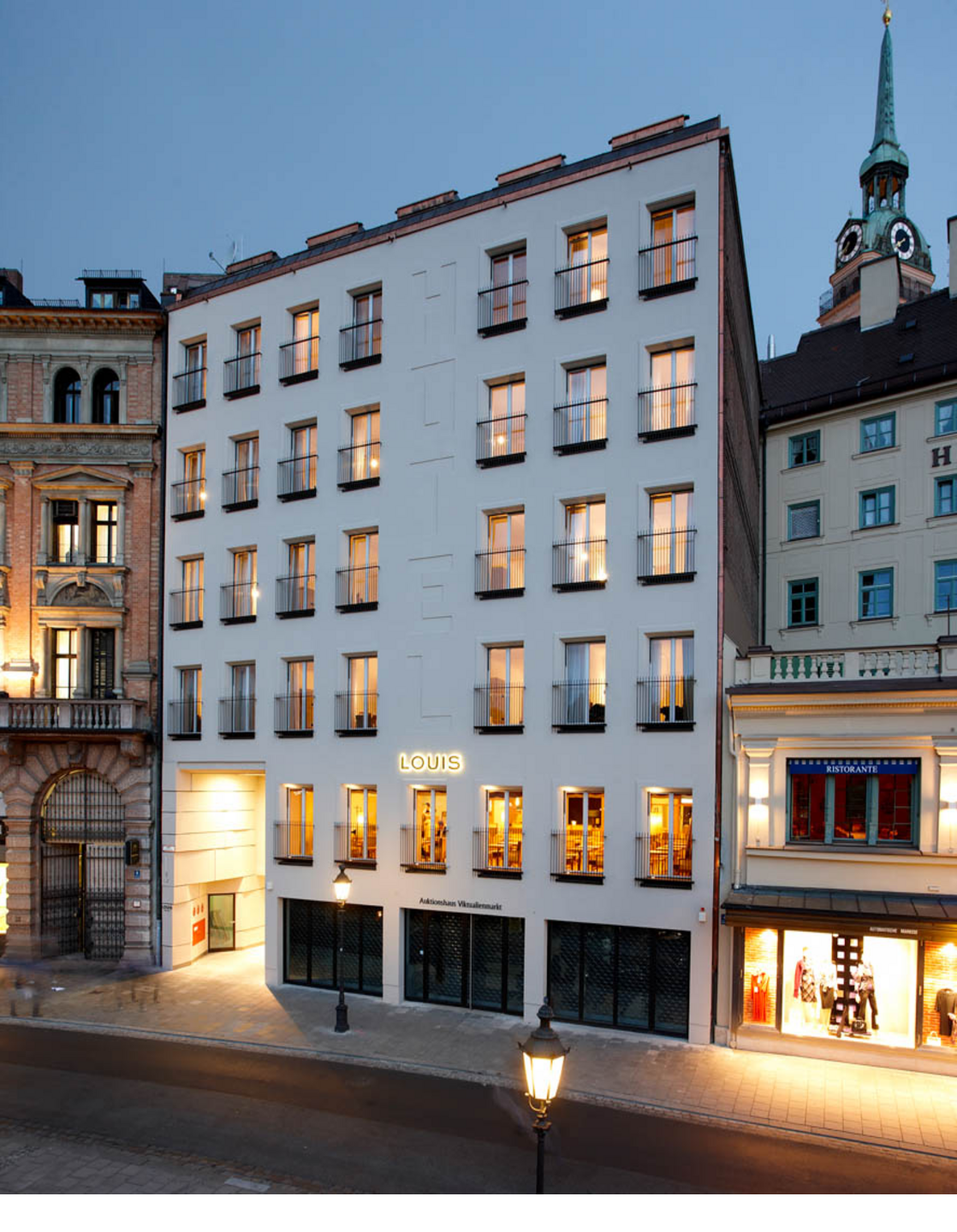 Exterior view at night LOUIS Hotel Munich