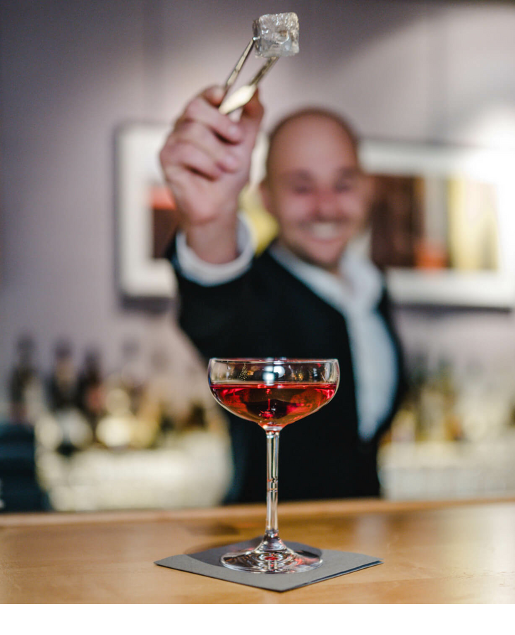 Bartender mixes a cocktail in The LOUIS Sparkling Bar at the LOUIS Hotel in Munich