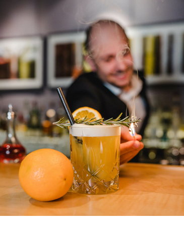 Bartender mixes a cocktail in The LOUIS Sparkling Bar at the LOUIS Hotel in Munich