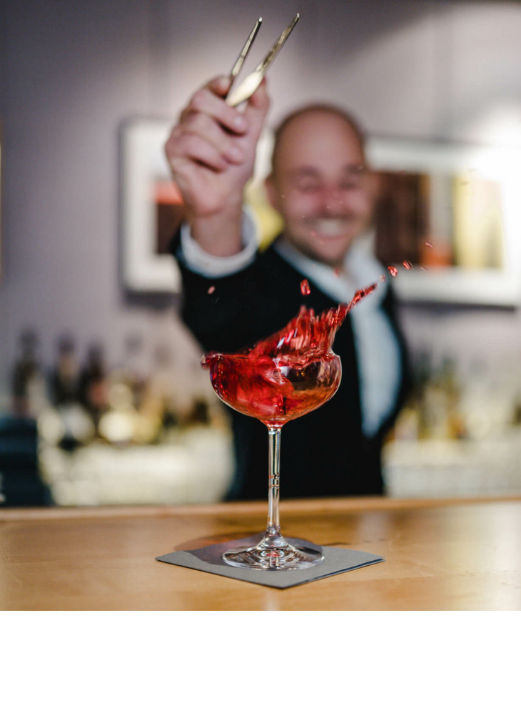Bartender mixes a cocktail in The LOUIS Sparkling Bar at the LOUIS Hotel in Munich